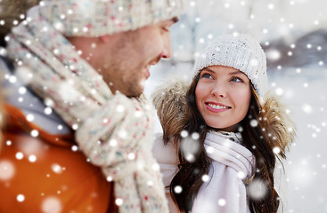 Image showing happy couple walking over winter background