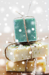 Image showing close up of handmade soap bars on wood