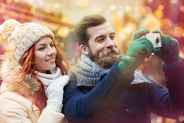 Image showing couple taking selfie with smartphone in old town