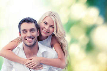 Image showing happy couple having fun over green background