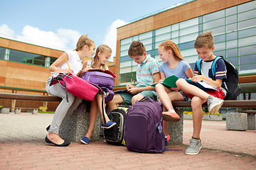 Image showing group of happy elementary school students outdoors