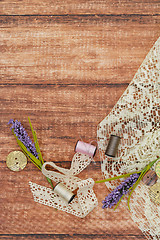 Image showing Lace and thread on wooden background