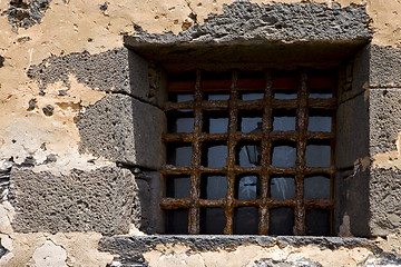 Image showing brown distorted  castle window in a broke   wall arrecife  