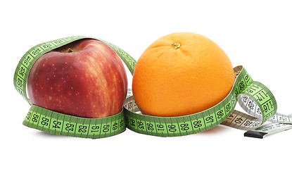 Image showing apple and orange and measure tape
