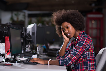 Image showing a young African American woman feels tired in the modern office