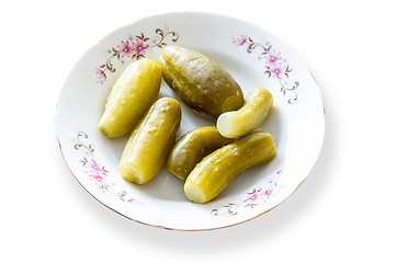Image showing Pickled cucumber in white plate isolated on background wjit clipping mask