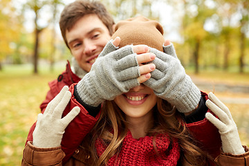 Image showing happy young couple having fun in autumn park