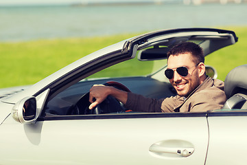 Image showing happy man driving cabriolet car outdoors