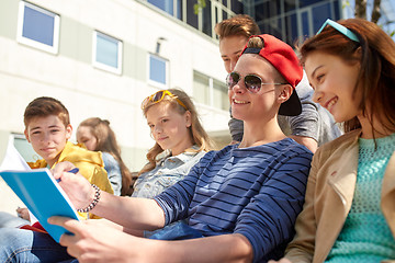 Image showing group of students with notebooks at school yard