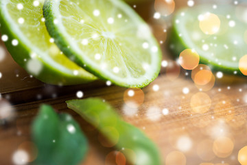 Image showing lime slices on wooden table