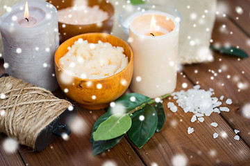 Image showing natural body scrub and candles on wood