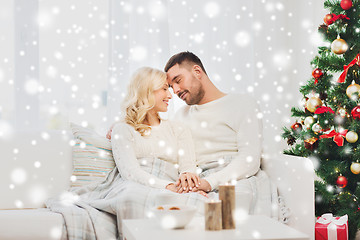 Image showing happy couple at home with christmas tree