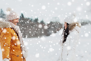 Image showing happy couple walking over winter background