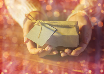 Image showing close up of woman hands with christmas gift