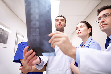 Image showing group of medics with spine x-ray scan at hospital