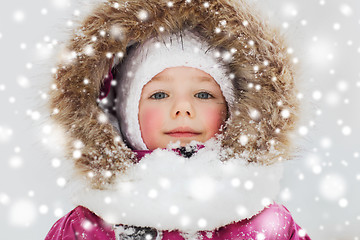 Image showing face of happy little kid or girl in winter clothes