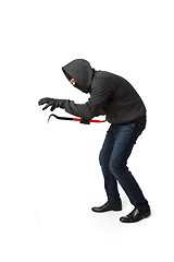 Image showing Crouching burglar with master key