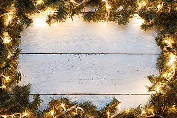 Image showing New year wooden background decorated Christmas tree and lights