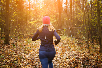 Image showing Young girl running in park