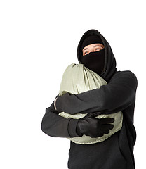 Image showing Robber hugging bag of money