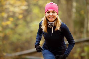 Image showing Girl in cap ready run