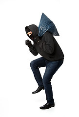 Image showing Burglar slinking with large bag