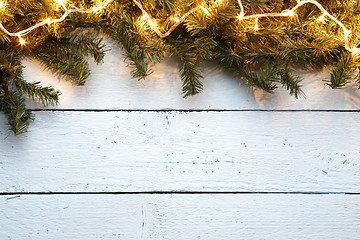 Image showing Wooden background with spruce branches for Christmas New Year holidays