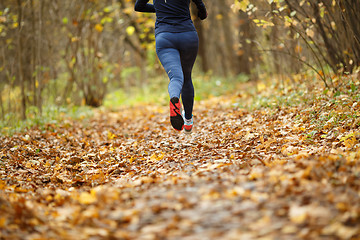 Image showing Sportswoman sneakers running autumn