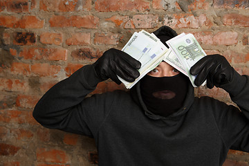 Image showing Burglar standing in black mask