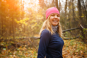 Image showing Young woman running in park