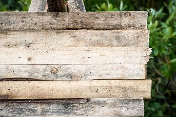 Image showing blank wood sign background. rough planks with nails, texture