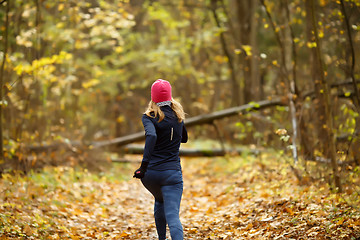 Image showing Blonde girl running in morning