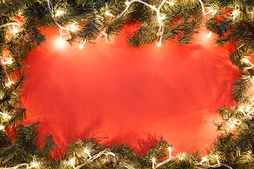 Image showing Spruce branches on red background