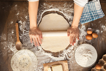 Image showing Female cooking dough.