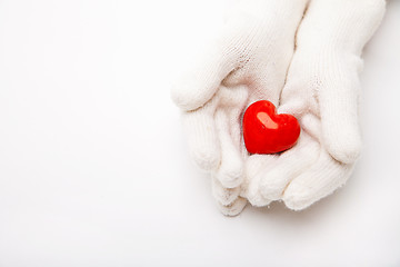 Image showing Woman hands in white gloves holding heart symbol