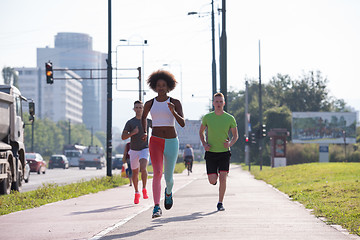 Image showing multiethnic group of people on the jogging