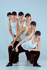 Image showing Group of men and women dancing hip hop choreography