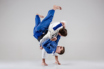 Image showing The two judokas fighters fighting men