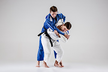 Image showing The two judokas fighters fighting men