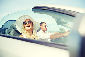 Image showing happy man and woman driving in cabriolet car