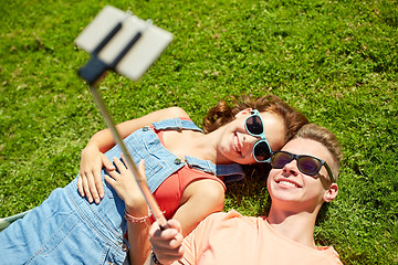 Image showing happy couple taking selfie on smartphone at summer