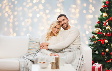 Image showing happy couple hugging over christmas tree