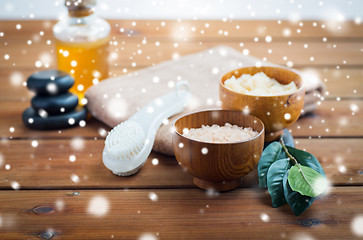 Image showing himalayan pink salt, massage brush and bath towel