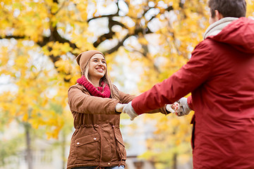 Image showing happy young couple having fun in autumn park