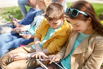 Image showing group of students with tablet pc at school yard