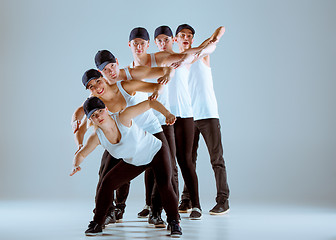 Image showing Group of men and women dancing hip hop choreography