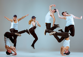 Image showing Group of men and women dancing hip hop choreography