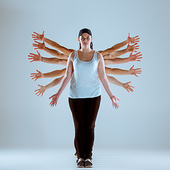 Image showing Group of men and women dancing hip hop choreography