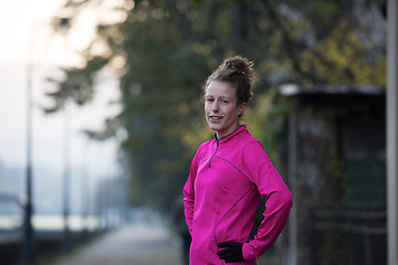 Image showing woman  stretching before morning jogging