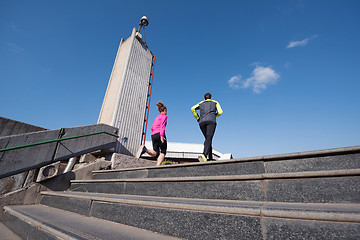 Image showing young  couple jogging on steps